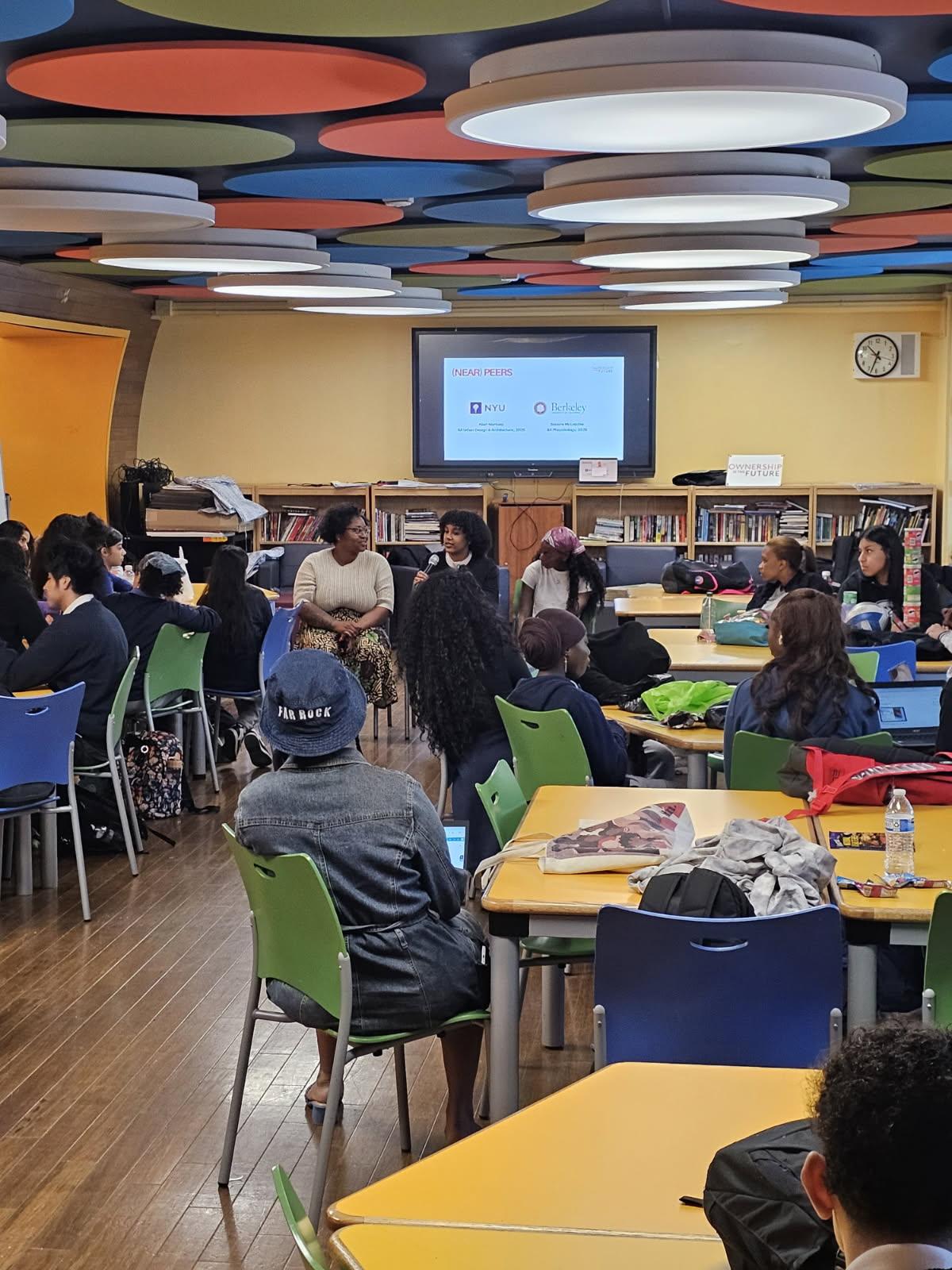 Students and educators in a school-based discussion