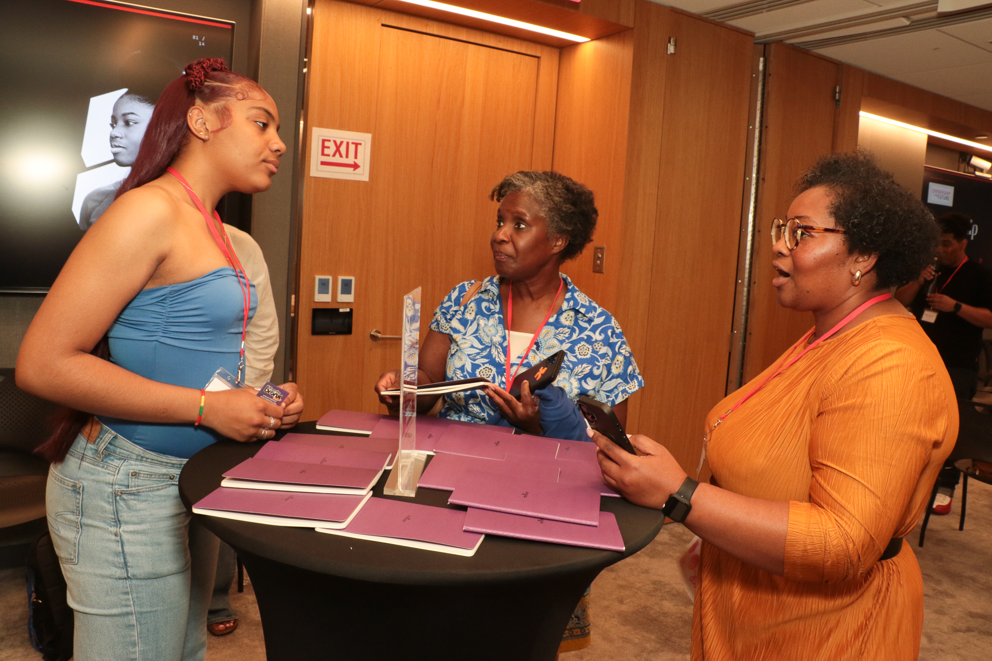 A young entrepreneur sharing her venture with community members